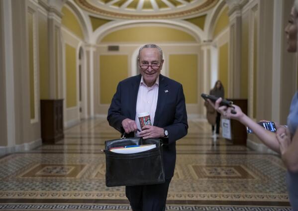 FILE - Senate Majority Leader Chuck Schumer, D-N.Y., returns to the Capitol in Washington, on the morning after Election Day Nov. 9, 2022. (AP Photo/J. Scott Applewhite, File)