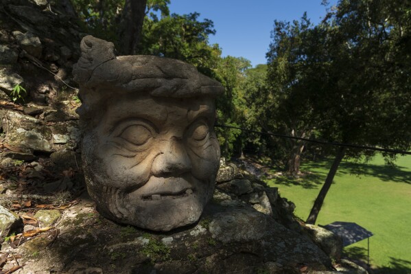 One of four heads of "Bacabs," gods also known as "Pauahtun," stands over Temple 11 in Copan, an ancient Maya site in western Honduras, Sunday, Sept. 24, 2023. Scientists are trying to understand how some ancient buildings have lasted for centuries in hopes of making modern buildings more durable. (AP Photo/Moises Castillo)