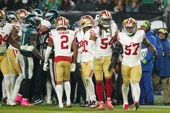 San Francisco 49ers linebacker Dre Greenlaw (57) looks on after an argument with Philadelphia Eagles players during the second half of an NFL football game, Sunday, Dec. 3, 2023, in Philadelphia. Greenlaw was ejected from the contest as a result of the scuffle. (AP Photo/Chris Szagola)