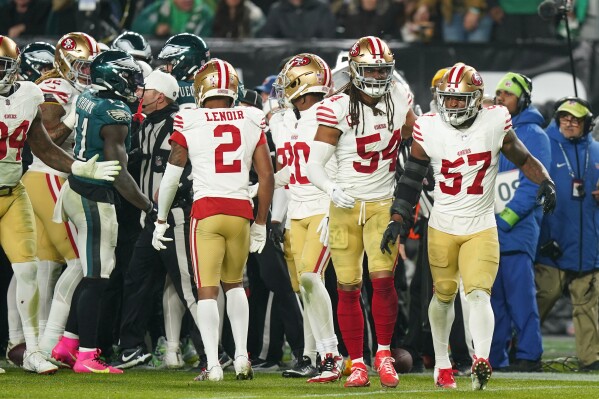 San Francisco 49ers linebacker Dre Greenlaw (57) looks on after an argument with Philadelphia Eagles players during the second half of an NFL football game, Sunday, Dec. 3, 2023, in Philadelphia. Greenlaw was ejected from the contest as a result of the scuffle. (APPhoto/Chris Szagola)