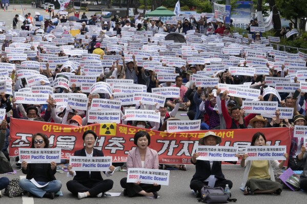 South Korean fishermen stage a rally against Japanese government's decision to release treated radioactive water from Fukushima nuclear power plant, in front of the National Assembly in Seoul, South Korea, Monday, June 12, 2023. (AP Photo/Ahn Young-joon)