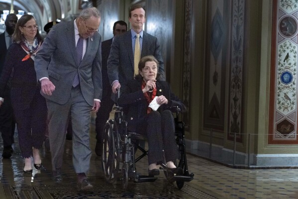 FILE - Sen. Dianne Feinstein, D-Calif., accompanied by Senate Majority Leader Chuck Schumer, D-N.Y., arrives at the U.S. Capitol, Wednesday, May 10, 2023, in Washington. (AP Photo/Jose Luis Magana, File)