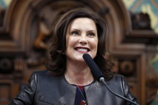 FILE - In this Jan. 29, 2020, file photo, Michigan Gov. Gretchen Whitmer delivers her State of the State address to a joint session of the House and Senate, at the state Capitol in Lansing, Mich. (AP Photo/Al Goldis, File)
