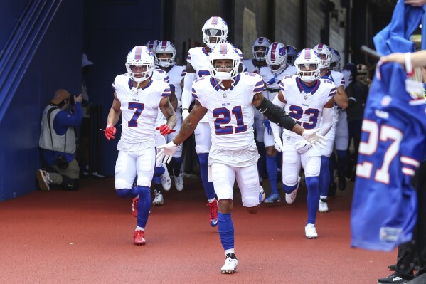 FILE - Buffalo Bills safety Jordan Poyer (21) leads teammates onto the field for an NFL pre-season football game against the Indianapolis Colts, Aug. 12, 2023, in Orchard Park, N.Y. The Bills are drawing upon the lingering memories of an emotionally draining season last year by believing they are stronger because of it thanks to the emphasis coach Sean McDermott placed on mental health. (AP Photo/Gary McCullough, File)
