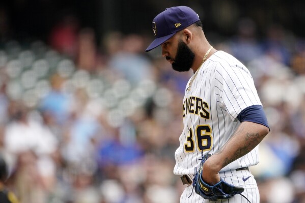 FILE - Milwaukee Brewers' J.C. Mejia (36) reacts after giving up a two-run home run to Pittsburgh Pirates' Bryan Reynolds during the eighth inning of a baseball game Sunday, Aug. 6, 2023, in Milwaukee. Brewers right-hander J.C. Mejía was suspended 162 games by Major League Baseball on Wednesday, Sept. 20, 2023, after testing positive for a performance-enhancing drug. (AP Photo/Aaron Gash, File)
