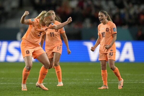 Netherlands' Stefanie Van der Gragt, left, celebrates with teammates after her goal was confirmed during the first half of the FIFA Women's World Cup Group E soccer match between the Netherlands and Portugal in Dunedin, New Zealand, Sunday, July 23, 2023. (AP Photo/Alessandra Tarantino)
