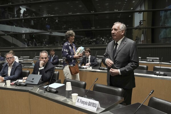 French Prime Minister Francois Bayrou arrives to face questions from a parliamentary inquiry into alleged abuse at a Catholic school amid accusations he has hidden what he knows about the scandal, in Paris, Wednesday May 14, 2025. (AP Photo/Aurelien Morissard)