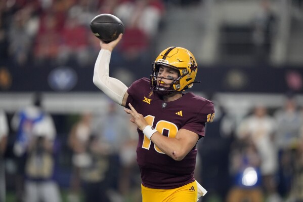 Arizona State quarterback Sam Leavitt (10) throws a pass in the first half of the Big 12 Conference championship NCAA college football game against Iowa State, in Arlington, Texas, Saturday Dec. 7, 2024. (AP Photo/LM Otero, File)