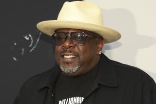 FILE - Cedric the Entertainer appears at the world premiere of the "Black Godfather" in Los Angeles on June 3, 2019. Cedric the Entertainer will host the Emmy Awards in September as the ceremony returns to a live telecast after last year’s pandemic-forced virtual event. There will be a limited audience of nominees and guests at the Microsoft Theatre for the Sept. 19 show airing on CBS. (Photo by Mark Von Holden/Invision/AP, File)