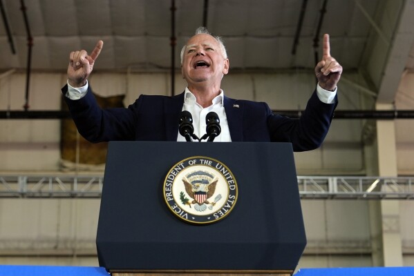 Democratic vice presidential candidate Minnesota Gov. Tim Walz speaks at a campaign rally Wednesday, Aug. 7, 2024, in Romulus, Mich., before Democratic presidential nominee Vice President Kamala Harris. (AP Photo/Julia Nikhinson)