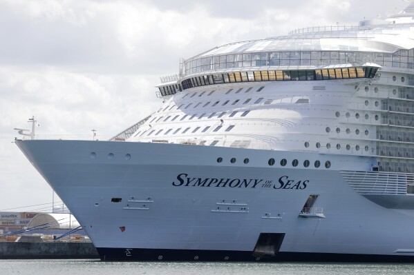 FILE - In this Wednesday, May 20, 2020, file photo, the Symphony of the Seas cruise ship is shown docked at PortMiami, in Miami. A 34-year-old Royal Caribbean cruise employee is accused of hiding cameras inside bathrooms of passenger cabins to spy on guests. Arvin Joseph Mirasol was arrested Sunday, March 3, 2024, on federal charges of production and possession of child pornography after the Symphony of the Seas arrived at Port Everglades in Fort Lauderdale. (AP Photo/Wilfredo Lee, File)