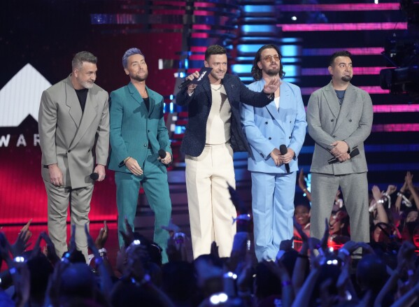 Joey Fatone, from left, Lance Bass, Justin Timberlake, JC Chasez and Chris Kirkpatrick of NSYNC present the award for best pop during the MTV Video Music Awards on Tuesday, Sept. 12, 2023, at the Prudential Center in Newark, N.J. (Photo by Charles Sykes/Invision/AP)
