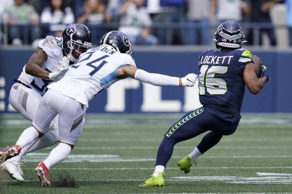 Seattle Seahawks wide receiver Tyler Lockett (16) smiles while