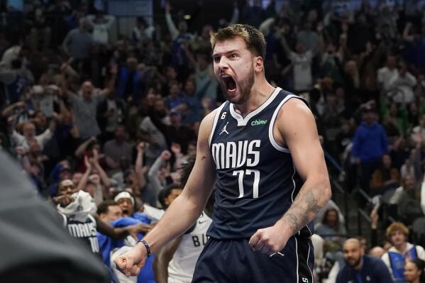 Dallas Mavericks guard Luka Doncic reacts to scoring a basket against the Milwaukee Bucks during the second half of an NBA basketball game in Dallas, Friday, Dec. 9, 2022. The Bucks won 106-105. (AP Photo/LM Otero)
