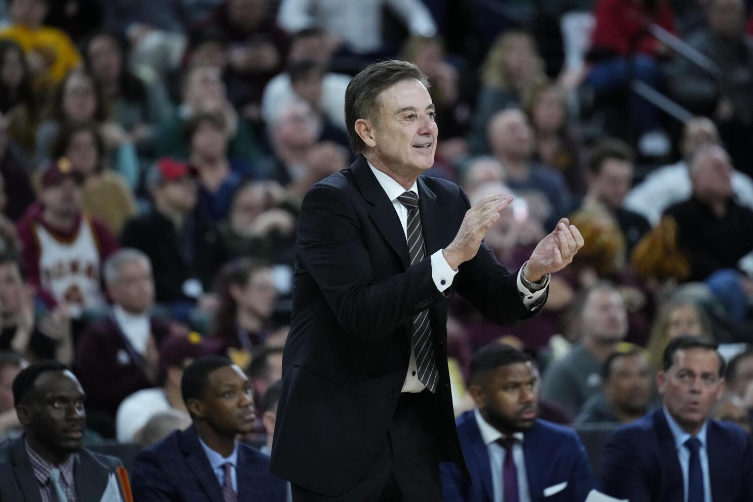 St. John's coach Rick Pitino throws out first pitch to Donovan