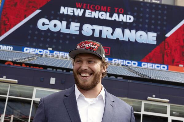 New England Patriots NFL football first-round draft pick offensive linesman Cole Strange smiles after a news conference at Gillette Stadium, Friday, April 29, 2022, in Foxborough, Mass. (AP Photo/Michael Dwyer)
