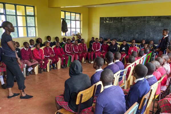 I'm Worth Defending officer Amelia Awuor, left, teaches a self-defense lesson at Enkakenya Centre for Excellence in Narok County, Kenya, on Feb. 1, 2025. (AP Photo/Nicholas Komu)