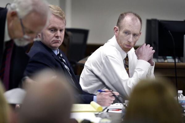 Chad Isaak, right, of Washburn, sits with his defense team during the third day of his murder trial at the Morton County Courthouse in Mandan, N.D., on Wednesday, Aug. 4, 2021. Isaak is on trial for the killings of four people at RJR Maintenance and Management in Mandan on April 1, 2019. (Mike McCleary/The Bismarck Tribune via AP)