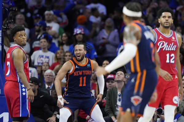 New York Knicks' Jalen Brunson (11) reacts after a basket during the second half of Game 4 in an NBA basketball first-round playoff series against the Philadelphia 76ers, Sunday, April 28, 2024, in Philadelphia. (AP Photo/Matt Slocum)
