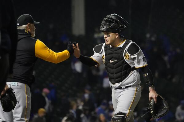 Pittsburgh Pirates manager Derek Shelton, left, and catcher Roberto Perez celebrate their win over the Chicago Cubs in a baseball game Friday, April 22, 2022, in Chicago. (AP Photo/Charles Rex Arbogast)