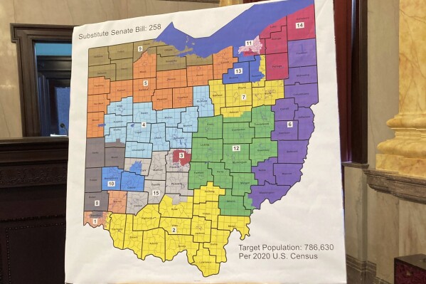 FILE - A map of Ohio congressional districts is displayed during a committee hearing at the Ohio Statehouse in Columbus, Ohio, on Nov. 16, 2021. The Ohio Attorney General's Office has rejected petition language for a constitutional amendment aimed at remaking Ohio’s troubled political-mapmaking system. Republican Dave Yost said Wednesday, Aug. 23, 2023, that the submission, by the group Citizens Not Politicians, failed to present a fair and truthful summary of what is proposed. (AP Photo/Julie Carr Smyth, File)