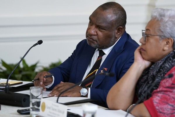 FILE - Papua New Guinean Prime Minister James Marape, left, listens during a meeting with Pacific Islands Forum leaders during the U.S.-Pacific Islands Forum Summit in the East Room of the White House, Monday, Sept. 25, 2023, in Washington. Prime Minister Marape accused Joe Biden of disparaging the South Pacific island nation by implying that an uncle of the U.S. president had been eaten by “cannibals” there during World War II. (AP Photo/Evan Vucci, File)