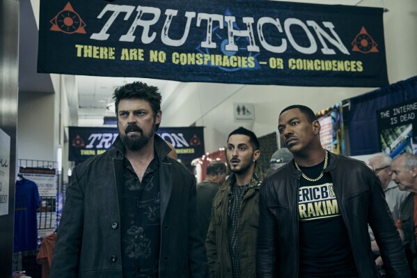 This image released by Prime Video shows Karl Urban, from left, Tomer Capone and Laz Alonso in a scene from the fourth season of "The Boys." (Jan Thijs/Prime Video via AP)
