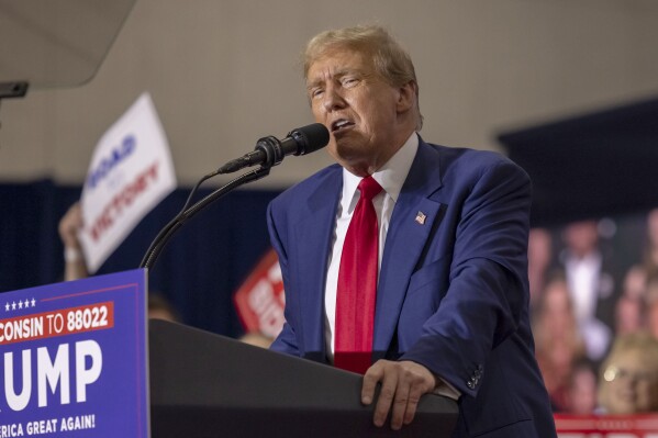 FILE - Republican presidential candidate former President Donald Trump speaks April 2, 2024, at a rally in Green Bay, Wis. Trump is accusing Joe Biden of offering a weak response to antisemitism, wielding the clashes on colleges campuses over the war in Gaza as a campaign issue. But Trump’s attacks ignore his own long history of rhetoric that invokes the language of Nazi Germany and plays on stereotypes of Jews and politics. (Ǻ Photo/Mike Roemer, File)