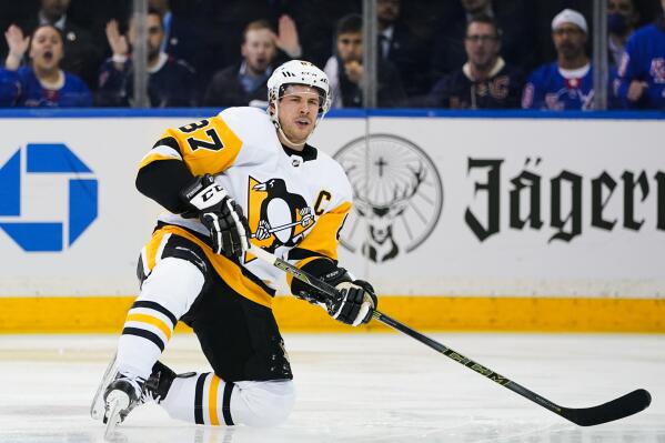 Pittsburgh Penguins' Sidney Crosby (87) reacts after getting knocked down during the first period of Game 5 of an NHL hockey Stanley Cup first-round playoff series against the New York Rangers Wednesday, May 11, 2022, in New York. (AP Photo/Frank Franklin II)