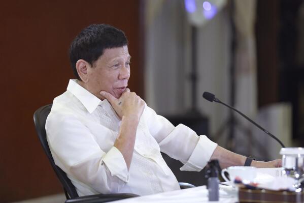 In this photo provided by the Malacanang Presidential Photographers Division, Philippine President Rodrigo Duterte gestures during a meeting with government officials at the Malacanang presidential palace in Manila, Philippines on Monday May 23, 2022. Outgoing Philippine President Duterte sharply criticized Russian leader Vladimir Putin for the killings of innocent civilians in Ukraine, saying while the two of them have been tagged as killers, “I kill criminals, I don’t kill children and the elderly.” (Valerie Escalera/Malacanang Presidential Photographers Division via AP)