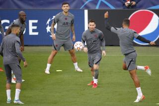 PSG's Lionel Messi, center right, during training at the Jan Breydel Stadium in Bruges, Belgium, Tuesday, Sept. 14, 2021. PSG will play its Champions League Group A soccer match against Club Brugge on Wednesday. (AP Photo/Olivier Matthys)