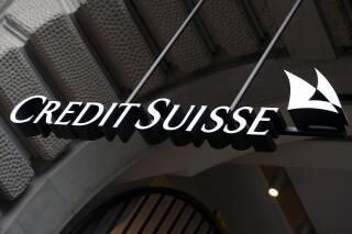 FILE - The logo of the Swiss bank Credit Suisse is seen on a building in Zurich, Switzerland, Oct. 21, 2015. A German newspaper and other media say a leak of data from Credit Suisse, Switzerland’s second-biggest bank, reveals details of the accounts of more than 30,000 clients — some of them unsavory — and points to possible failures of due diligence in checks on many customers. Credit Suisse said it “strongly rejects the allegations and insinuations about the bank’s purported business practices.” The German newspaper Sueddeutsche Zeitung said it received the data anonymously through a secure digital mailbox over a year ago. (Walter Bieri/Keystone via AP, File)