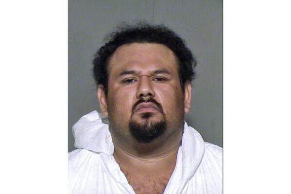FILE - This undated booking photo provided by the Maricopa County, Ariz., Sheriff's Office shows Apolinar Altamirano, who was sentenced to 38 years in prison on Friday, Aug. 19, 2022, for the 2015 shooting death of convenience store clerk Grant Ronnebeck in Mesa, Ariz. Prosecutors had initially sought the death penalty against Altamirano, but a court later ruled prosecutors couldn't pursue his execution because Altamirano is intellectually disabled. (Maricopa County Sheriff's Office via AP, File)