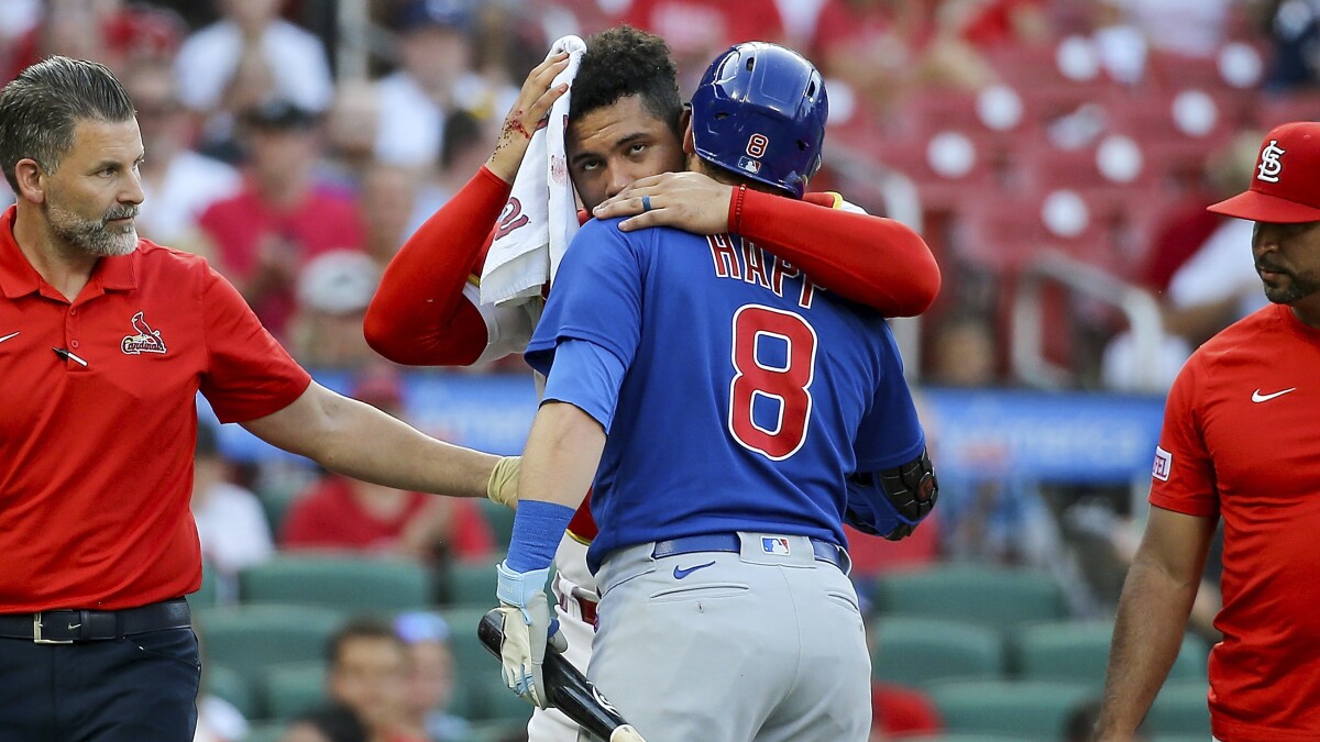 St. Louis Cardinals' Andrew Knizner is congratulated after his solo home run  against the Chicago Cubs during the fourth inning of a baseball game  Thursday, July 27, 2023, in St. Louis. (AP