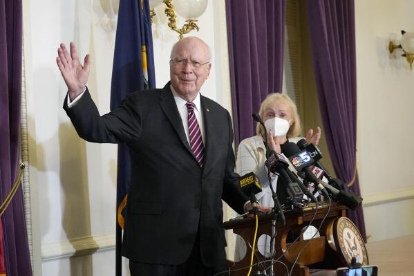 Sen. Patrick Leahy, D-Vt., acknowledges applause as his wife Marcelle Pomerleau applauds at the conclusion of a news conference at the Vermont State House to announce he will not seek re-election, Monday, Nov. 15, 2021, in Montpelier, V.T. (AP Photo/Mary Schwalm)