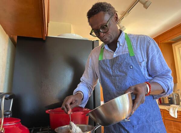Pierre Thiam, executive chef and co-founder of New York-based fine-casual food chain Teranga, cooks fonio, a variety of millet in El Cerrito, Calif., Friday, Jan. 27, 2023. “Fonio is nicknamed the Lazy Farmers crop. That’s how easy it is to grow," Thiam said. (AP Photo/Haven Daley)