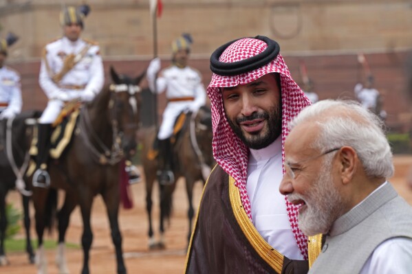 Crown Prince Mohammed bin Salman of Saudi Arabia, left, speaks to Indian Prime Minister Narendra Modi upon his arrival for a ceremonial reception at the Indian presidential palace, in New Delhi, India, Monday, Sept. 11, 2023. (AP Photo/Manish Swarup)