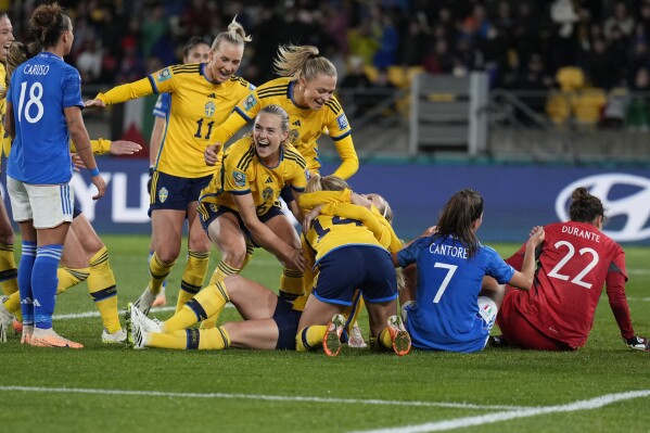 Sweden's Amanda Ilestedt, celebrates with teammates after scoring the opening goal during the Women's World Cup Group G soccer match between the Sweden and Italy in Wellington, New Zealand, Saturday, July 29, 2023. (AP Photo/John Cowpland)