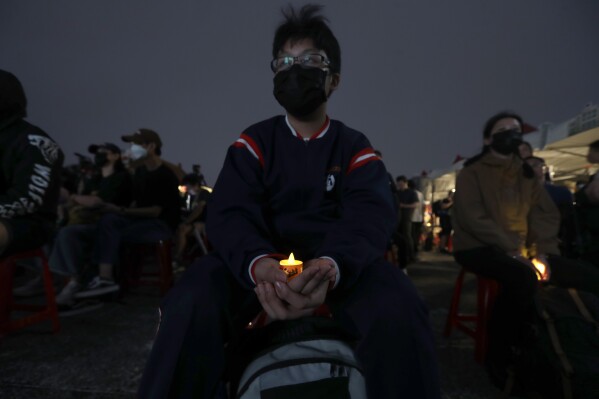 Participants attend a candlelight vigil at Democracy Square to mark the 36th anniversary of the Chinese military crackdown on the pro-democracy movement in Beijing's Tiananmen Square, in Taipei, Taiwan, Wednesday, June 4, 2025. (AP Photo/Chiang Ying-ying)