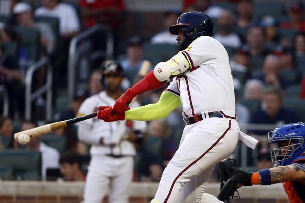 Ozuna homers twice as Braves tie HR record with 307 in 10-9 loss