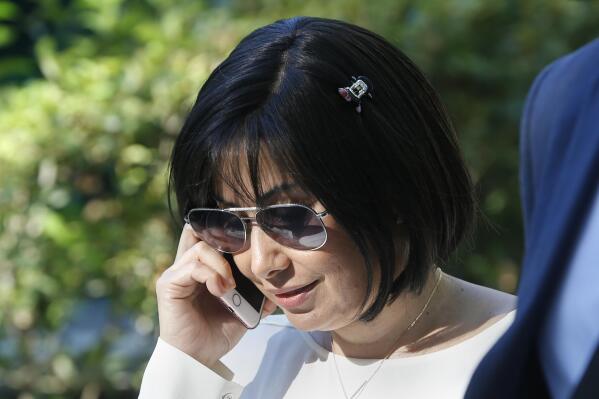 FILE - In this Sept. 24, 2018 file photo, Claudia Patricia Diaz Guillen, the nurse of former Venezuelan President Hugo Chavez, leaves the national court in Madrid, Spain. Spain's National Court has consented to the extradition to the United States of ex-Venezuelan leader Hugo Chávez's former nurse, who is charged in Miami with money laundering. The court said in a statement that its magistrates consider that all requirements are met for the extradition of Claudia Díaz to proceed. (AP Photo/Paul White, File)