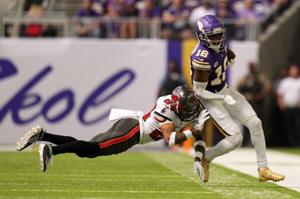 Minnesota Vikings wide receiver Justin Jefferson (18) plays during