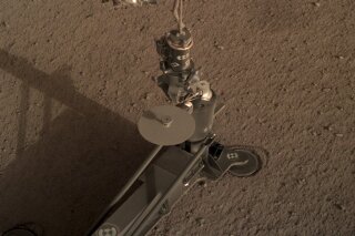 
              This photo provided by NASA/JPL-Caltech shows an image acquired by NASA's InSight Mars lander using its robotic arm-mounted, Instrument Deployment Camera (IDC). The image was acquired on March 1, 2019, Sol 92 where the local mean solar time for the image exposures was 16:53:31.055 PM. Scientists say NASA's newest Mars lander has started digging into the red planet, but has hit a few snags. (NASA/JPL-Caltech via AP)
            