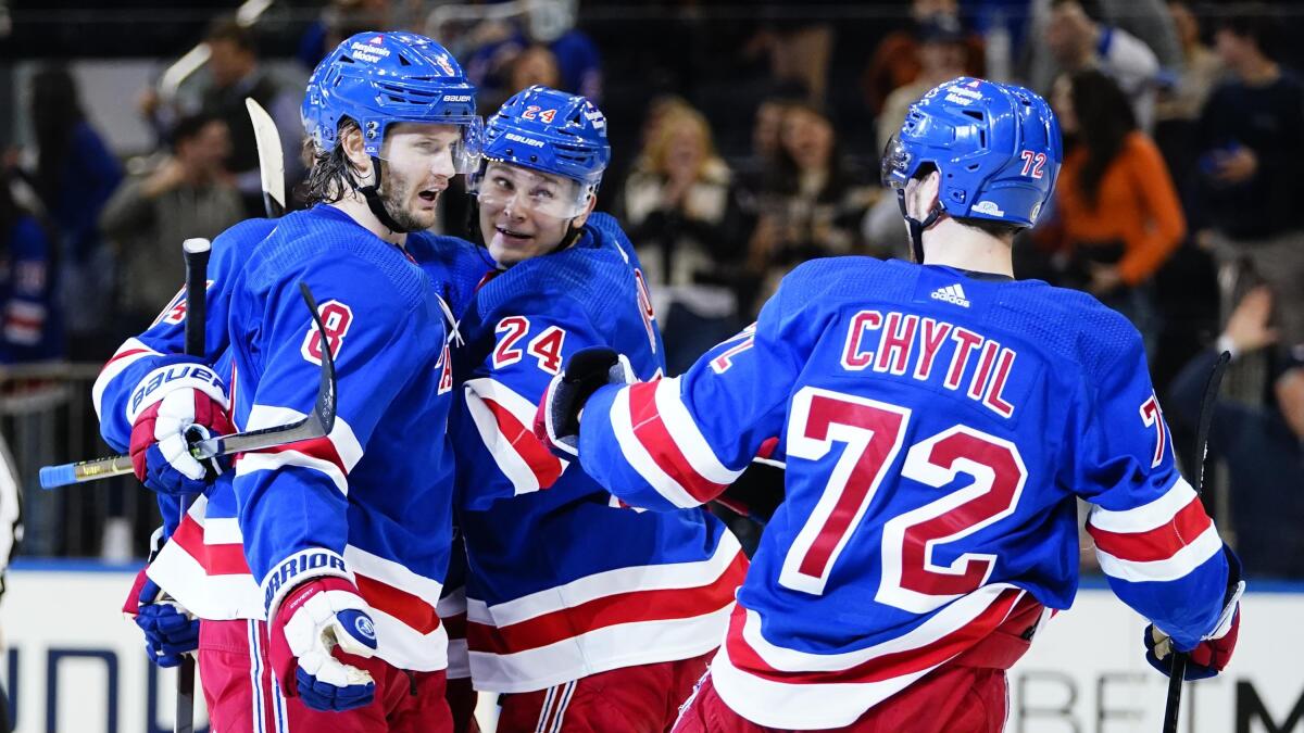 Rangers score 3 in 3rd to stop Hurricanes' win streak at 11 - The