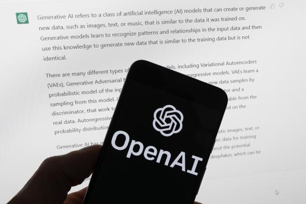 FILE - The OpenAI logo is seen on a mobile phone in front of a computer screen displaying output from ChatGPT, on March 21, 2023, in Boston. European lawmakers have rushed to add language on general artificial intelligence systems like ChatGPT as they put the finishing touches on the Western world's first AI rules. (AP Photo/Michael Dwyer, File)