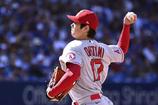 Los Angeles Angels starting pitcher Shohei Ohtani (17) throws to a Toronto Blue Jays batter during the first inning of a baseball game, Saturday, Aug. 27, 2022 in Toronto. (Jon Blacker/The Canadian Press via AP)