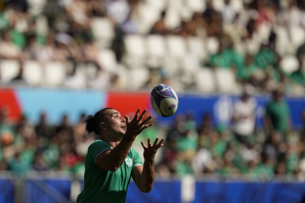 Ireland's James Lowe catches the ball during the Rugby World Cup Pool B match between Ireland and Romania at the Stade de Bordeaux in Bordeaux, France, Saturday, Sept. 9, 2023. (AP Photo/Themba Hadebe)