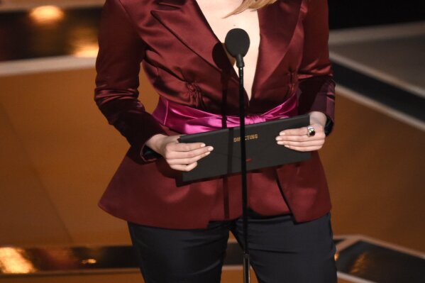 
              Emma Stone presents the award for best director at the Oscars on Sunday, March 4, 2018, at the Dolby Theatre in Los Angeles. (Photo by Chris Pizzello/Invision/AP)
            