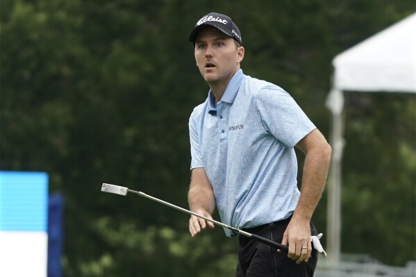 Russell Henley watches his putt on the 18th hole during the first round of the Wyndham Championship golf tournament in Greensboro, N.C., Thursday, Aug. 3, 2023. (AP Photo/Chuck Burton)