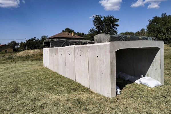 This image released by the Romanian Ministry of Defense (MAPN), shows a concrete shelter built by the army's engineering units in the village of Plauru, on the Danube river border between Romania and Ukraine on Tuesday, Sept. 12, 2023. In the Danube village of Plauru, which is situated opposite Ukraine's Danube port of Izmail, Romania's defense ministry has erected prefabricated concrete shelters for residents, measuring 9.6 meters long, 2 meters wide inside, and 1.5 meter high (about 31 feet long, 6.5 feet wide and 5 feet high). (Romanian Defense Ministry MAPN via AP)